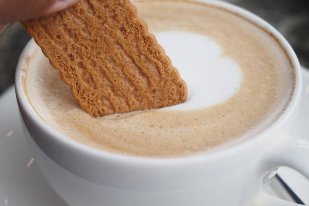 istock Dunking a Delicious Biscuit into a Warm and Inviting Cup of Freshly Brewed Coffee 2195901839