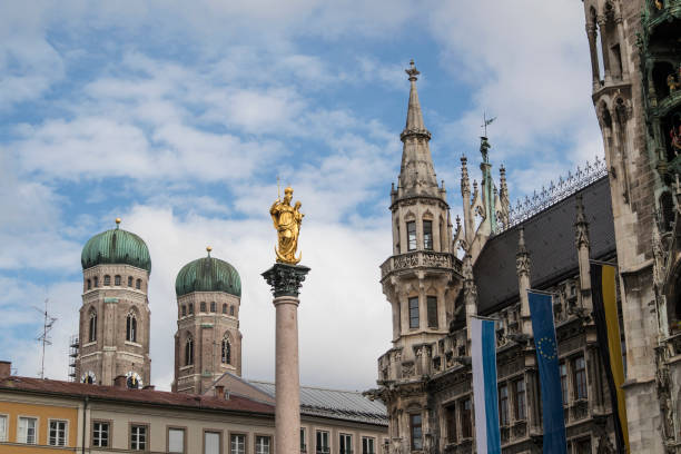 Marian column at Marienplatz, pedestrian zone in Munich, Bavaria, Germany in summertime
