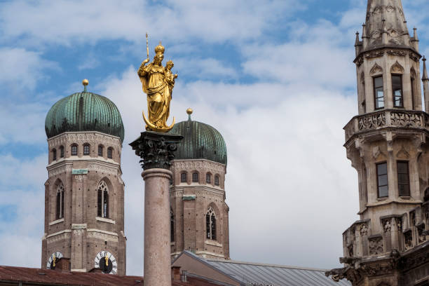 istock Marian column at Marienplatz, pedestrian zone in Munich, Bavaria, Germany 2195909001