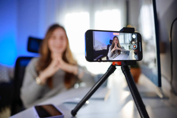 istock Smiling young female influencer doing a vlog post at home 2195909270
