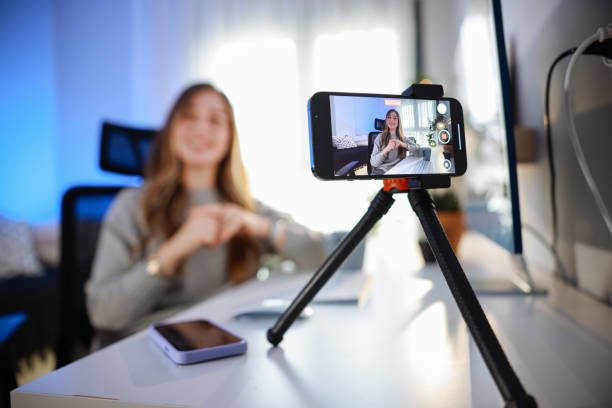 istock Smiling young female influencer doing a vlog post at home 2195910766