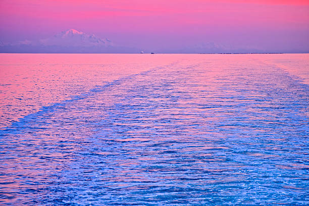 Wake from a BC Ferry with a view of the Strait of Georgia and the coastal mountains from Vancouver Island, British Columbia