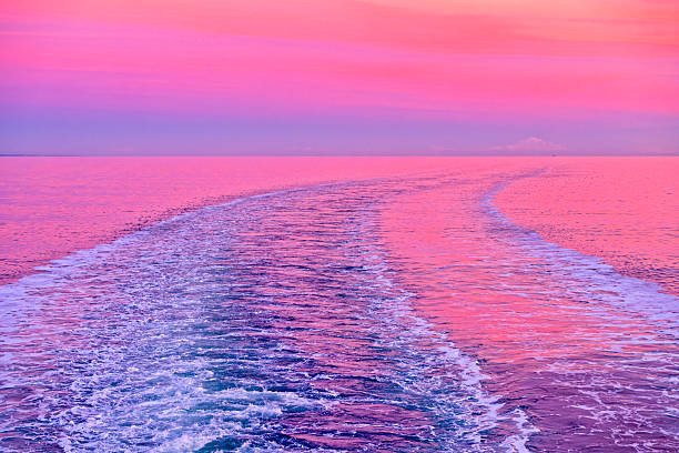 Wake from a BC Ferry with a view of the Strait of Georgia and the coastal mountains from Vancouver Island, British Columbia