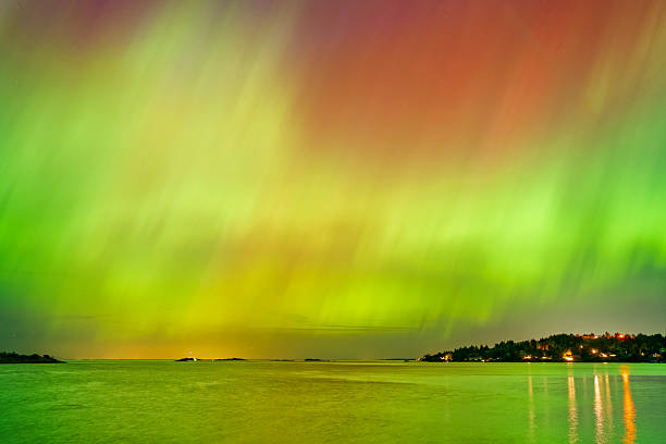 View of an Aurora over the Strait of Georgia and the coastal mountains from Vancouver Island, British Columbia