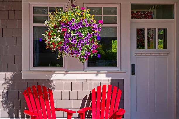 Hanging flower basket on a heritage style house on Vancouver Island, British Columbia