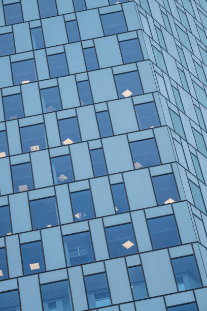 istock Windows of a tall skyscraper office building.. 2195914648