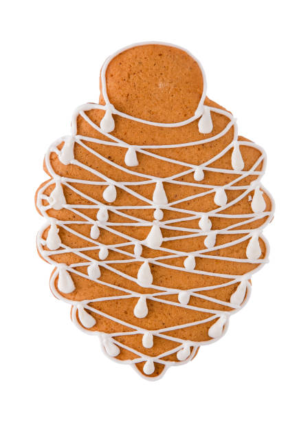 Decorative Gingerbread Pinecone Cookie decorated with white sugar glaze isolated on white background. Christmas cookies.