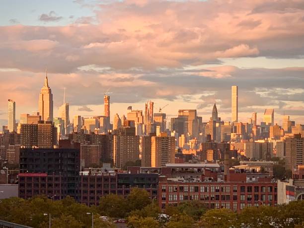 istock Pink Clouds Over New York City Skyline during Sunrise (Brooklyn, New York, USA) 2195919284