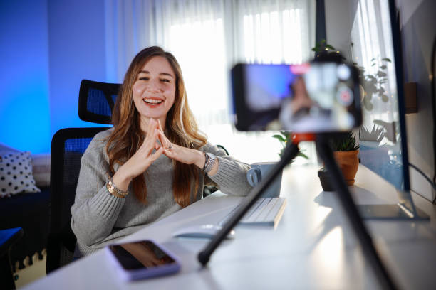 istock Smiling young female influencer doing a vlog post at home 2195922915