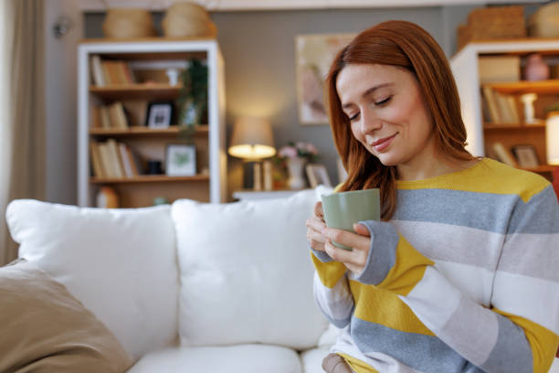 istock Serene Woman Enjoying a Warm Beverage at Home 2195924055