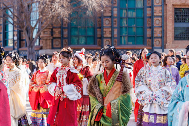 Barcelona - Spain, 25 January 2025: Traditional Chinese attire showcased in joyful New Year celebration