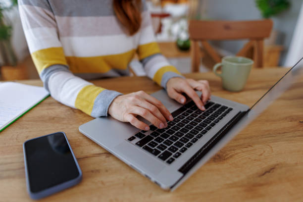 istock Woman working from home typing on laptop keyboard 2195924401