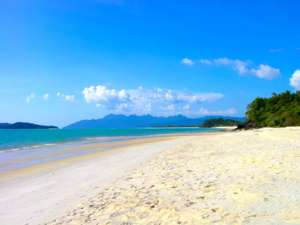 A beautiful long stretch of sandy beach at the island of Langkawi in West Malaysia