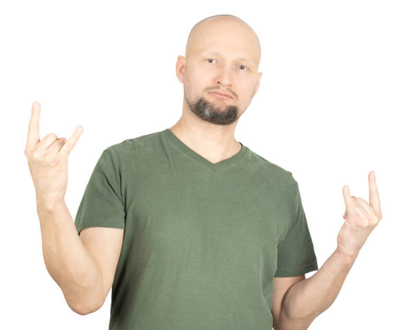istock Rock fan making metal horns hand gesture confidently 2195926533