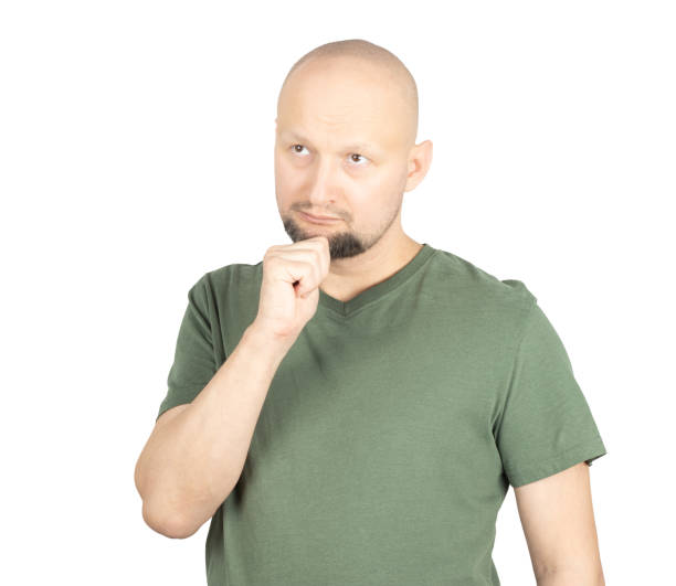 istock Serious man contemplating a decision with hand on chin 2195928241