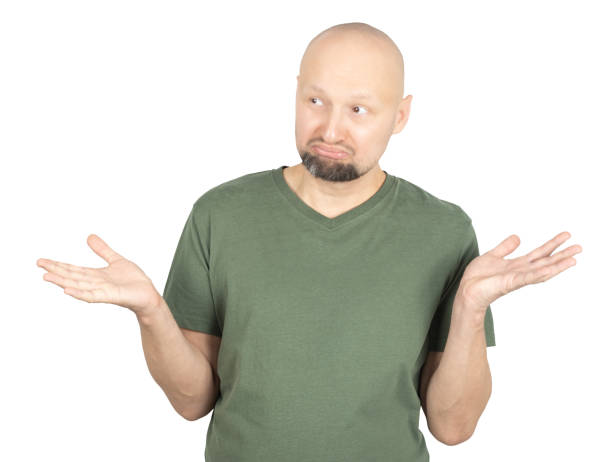 istock Confused man shrugging with raised hands and uncertain expression 2195928478