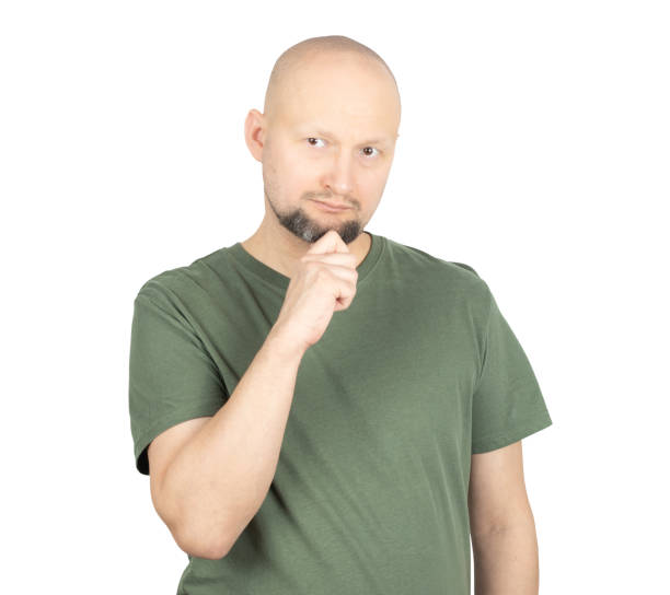 istock Thoughtful man touching his chin with a pensive expression 2195928588