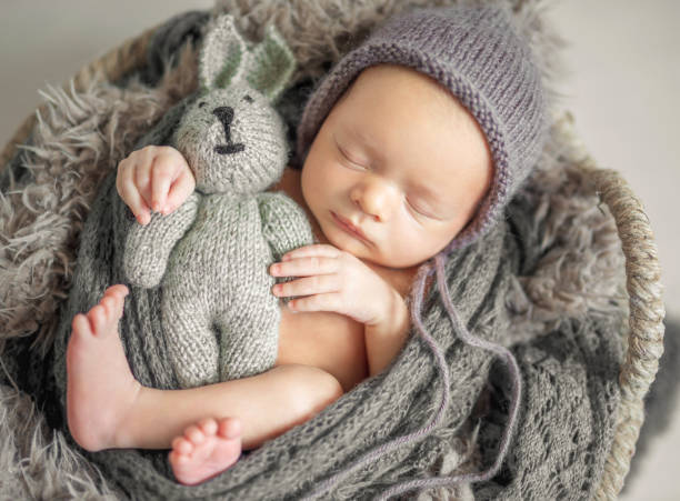 istock Newborn baby is sleeping sweetly 2195928597