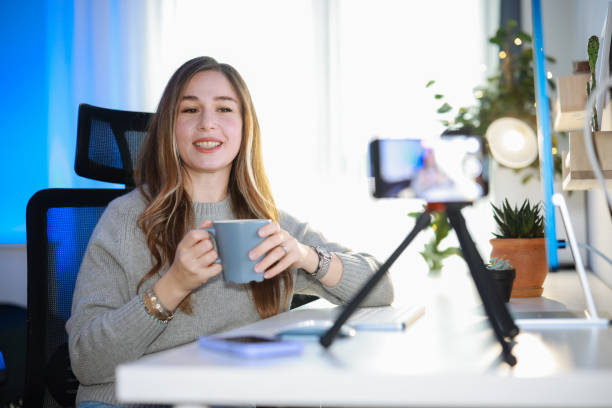 istock Smiling young female influencer doing a vlog post at home 2195928833