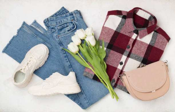 istock Flat lay with trendy spring outfit and flowers on concrete background 2195937089