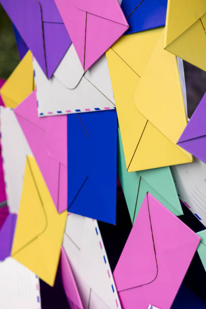 Colorful paper envelopes. Bright banner design, multicolored background. Vertical photo