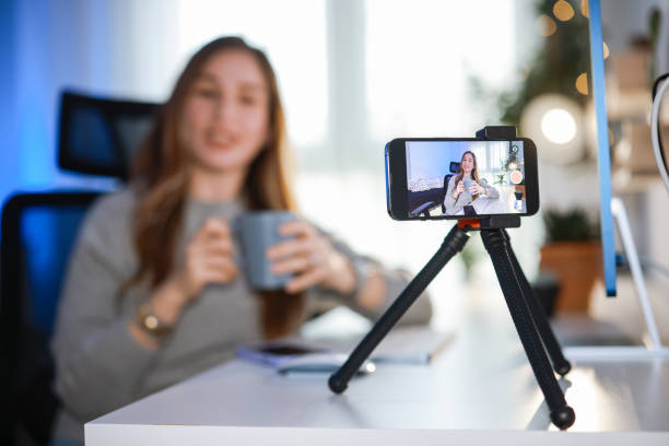 istock Smiling young female influencer doing a vlog post at home 2195938252