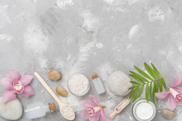 istock Composition with orchids, spa products on concrete background, top view 2195938533