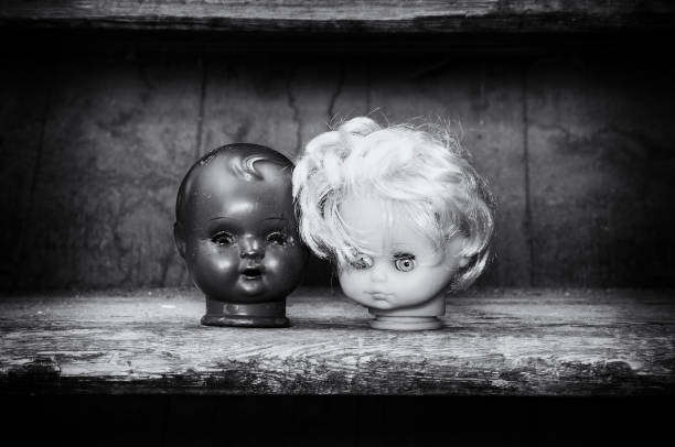 istock Scary image of two doll heads 2195939144