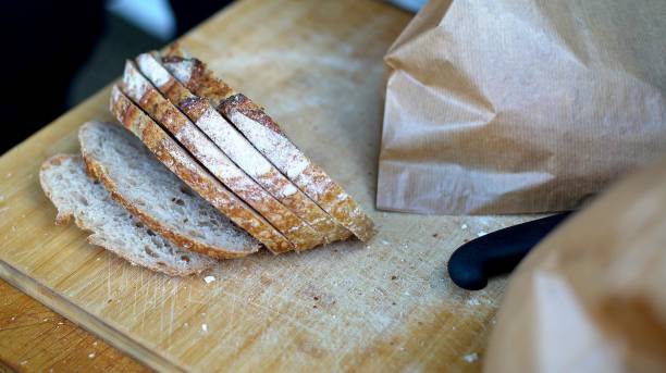 istock bread lies on a wooden board 2195939823