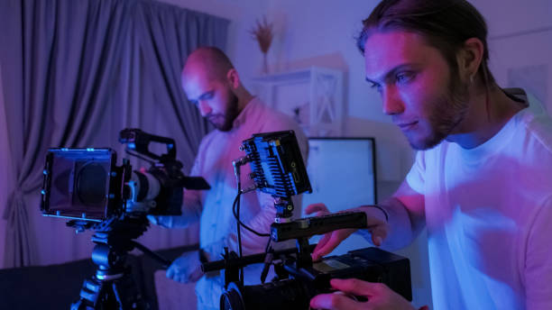 istock Cameraman backstage behind scene male videographer 2195941945