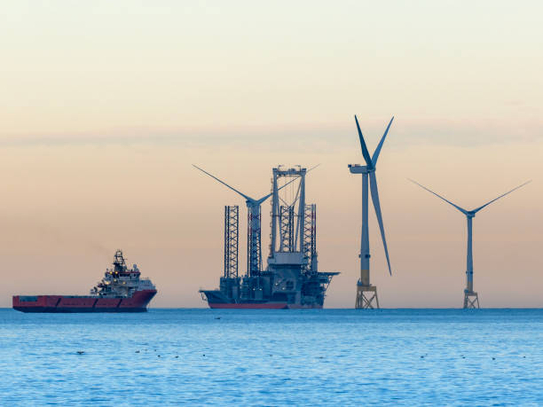 istock Wind farm installation vessel servicing wind turbines 2195944015