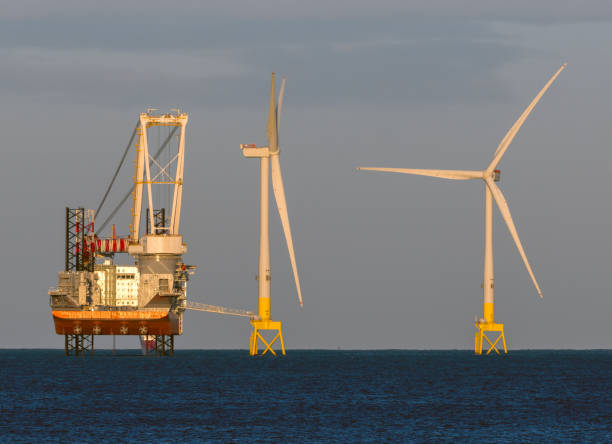 istock Wind farm installation vessel servicing wind turbines 2195944035