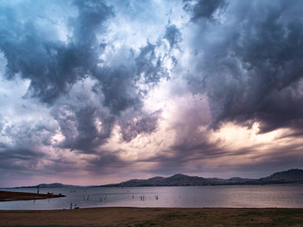 Beautiful dramatic sunset storm cloud over lake