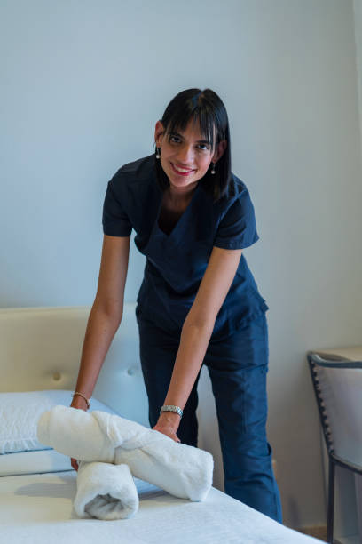 istock Housekeeper does her homework in the hotel while looking at a portrait 2195949249