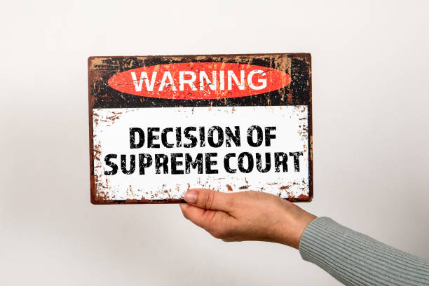 istock Decision of  supreme court. Warning sign with text on a light background 2195949480