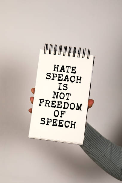 istock Freedom of speech. Notepad with text in a woman's hand 2195949489