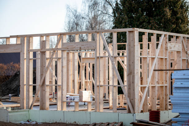 istock Wooden structures. Construction of a wooden frame private house 2195949511