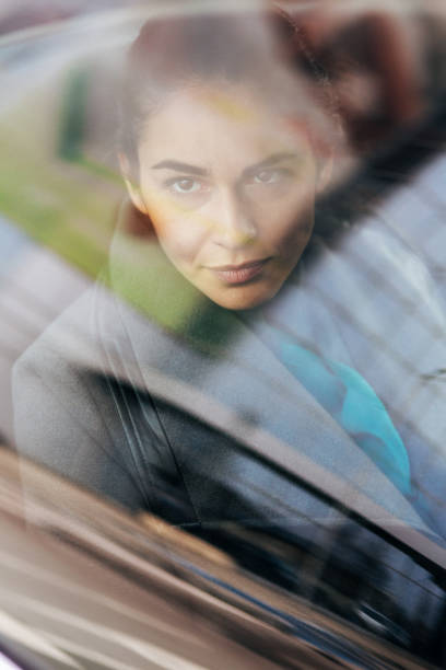 istock Woman looking through the car window 2195952217