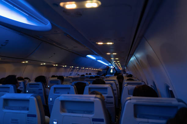 View inside airplane economy class cabin. The interior-themed futuristic Boeing
