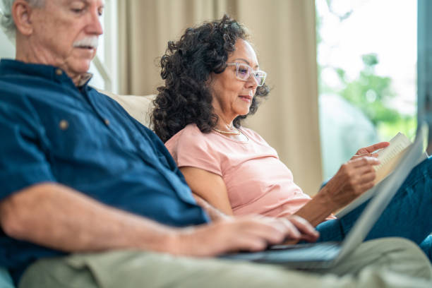 istock Elderly Couple Engages in Leisure Activities at Home 2195952986