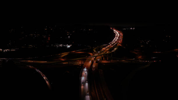 istock Cars on the highway at night 2195953647