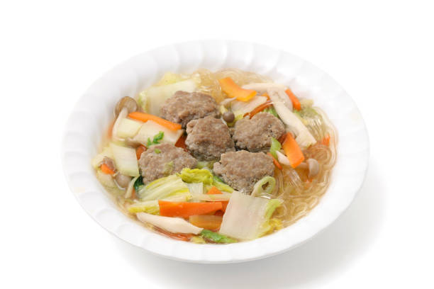 Meatballs and Japanese Hakusai vegetable boiled in a plate on white background