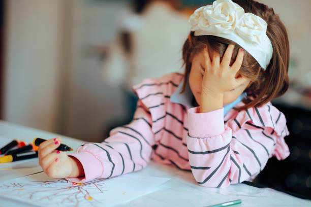 istock Unhappy Kid Feeling Frustrated with Her Dawning Assignment 2195959203