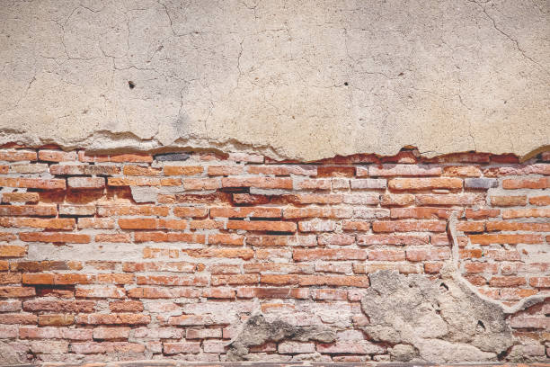 istock Old  red brick wall texture with decay and cracked concrete abstract on background 2195961136