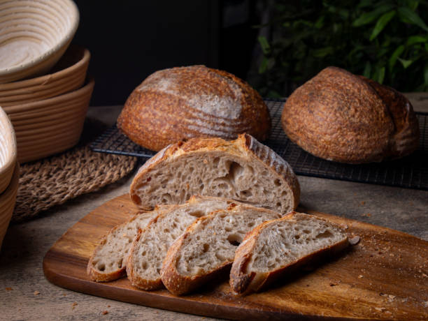 istock Sliced Artisan Sourdough Bread on Wooden Table. 2195965796
