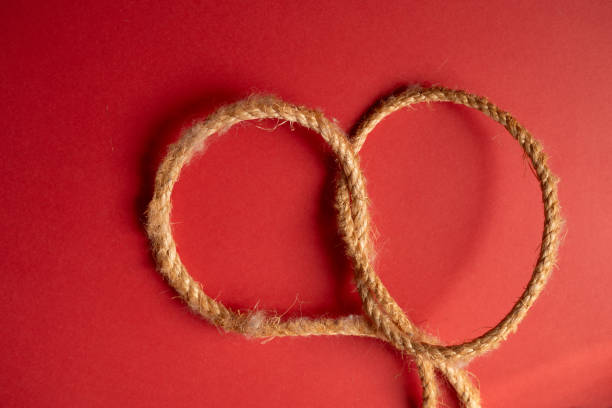 Rope tied on a red background