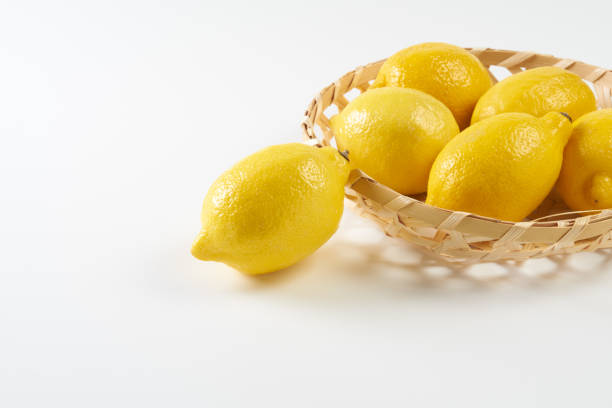 Fresh ripe yellow lemon fruit on white background