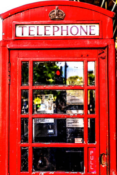 Traditional Red Pay Telephone Booth Westminster London England.  A symbol of England and the UK.