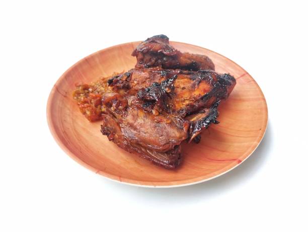 istock Ayam bakar kecap or Grilled chicken with soy sauce on plate on white background 2195976542