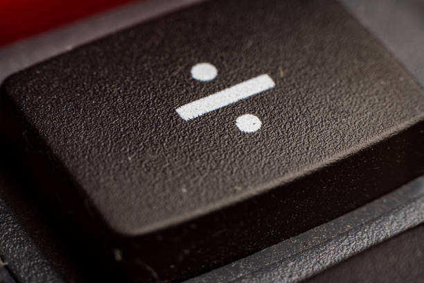 istock Closeup view of electronic keypad highlighting the divide button used for calculations 2195976747
